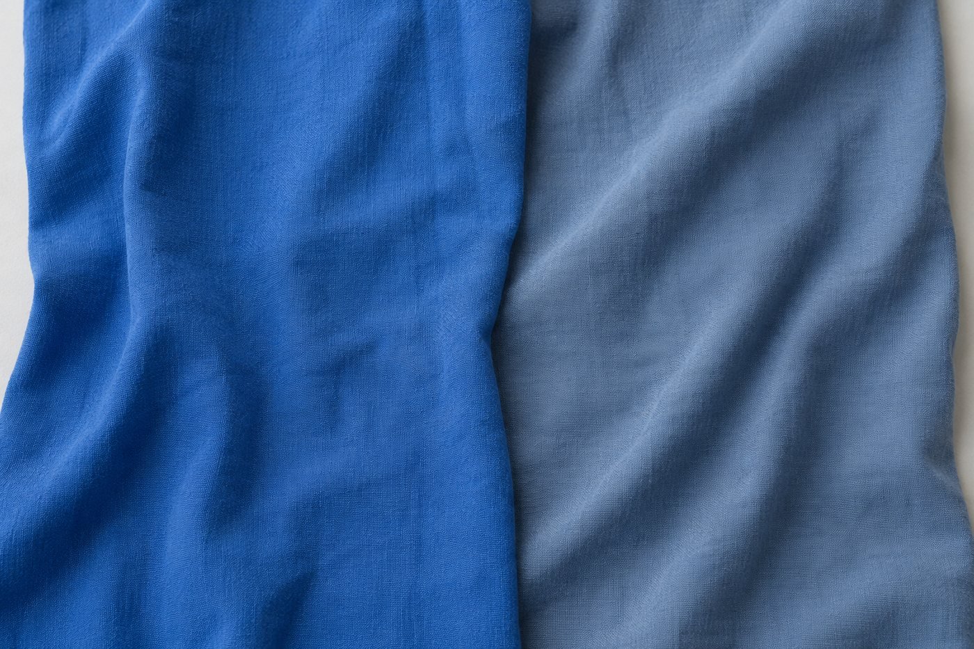 A clear jewel blue beside a muted slate of the same hue